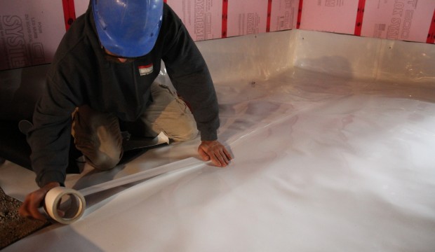 Crawl Space Encapsulation - Merging of the the joints with a tape specially designed for the vapor.